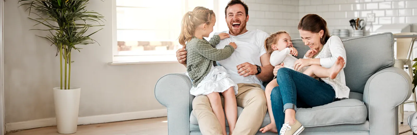 family laughing and having fun in pest free home